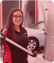 person smiling at car wash